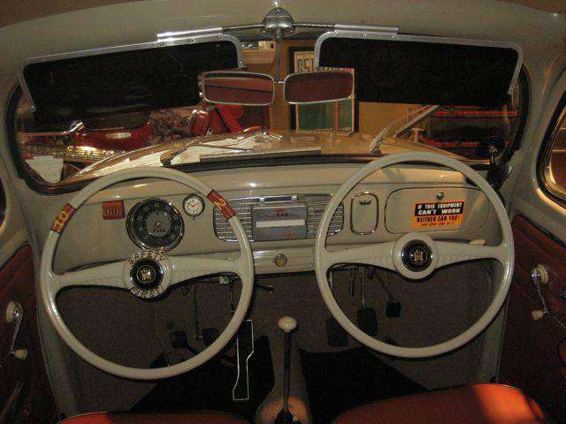 photo of a vintage car with 2 steering wheels, 2 mirrors, and 2 sets of pedals, featured in White Oak Security's penetration testing blog.